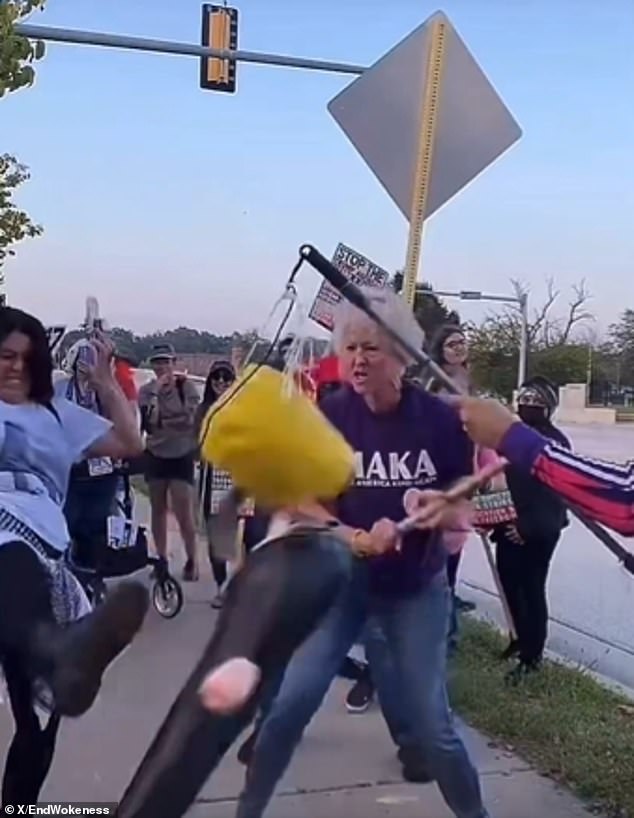 Protester Smashes Trump Piñata While Wearing 'Make America Kind Again' Shirt